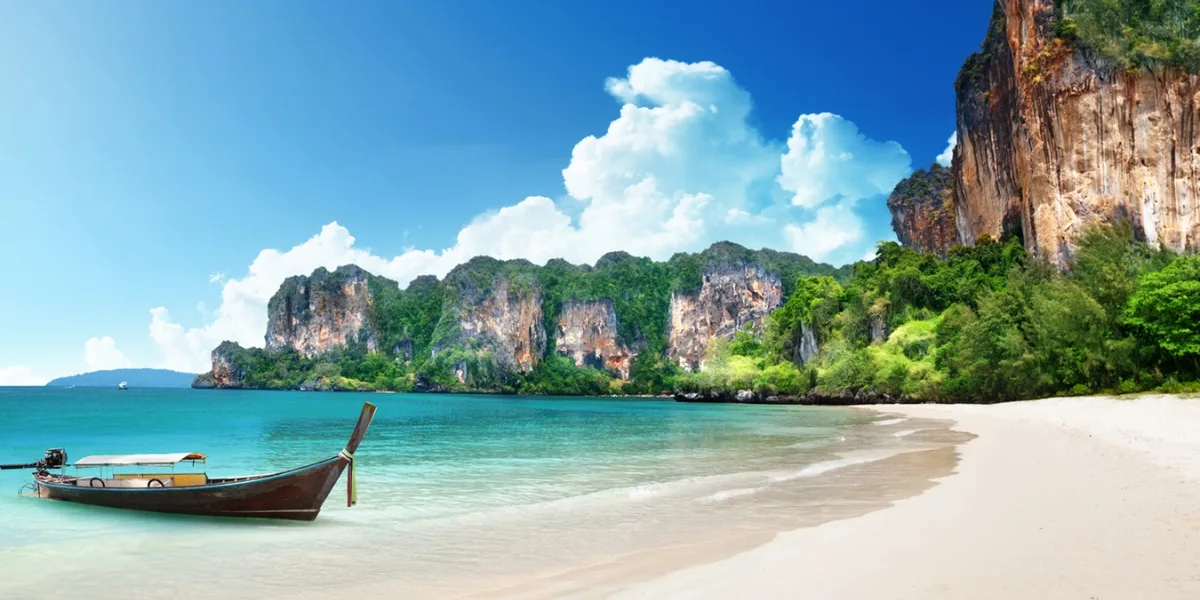 Phuket cityscape and Krabi natural landscape side by side showing travel experience contrast