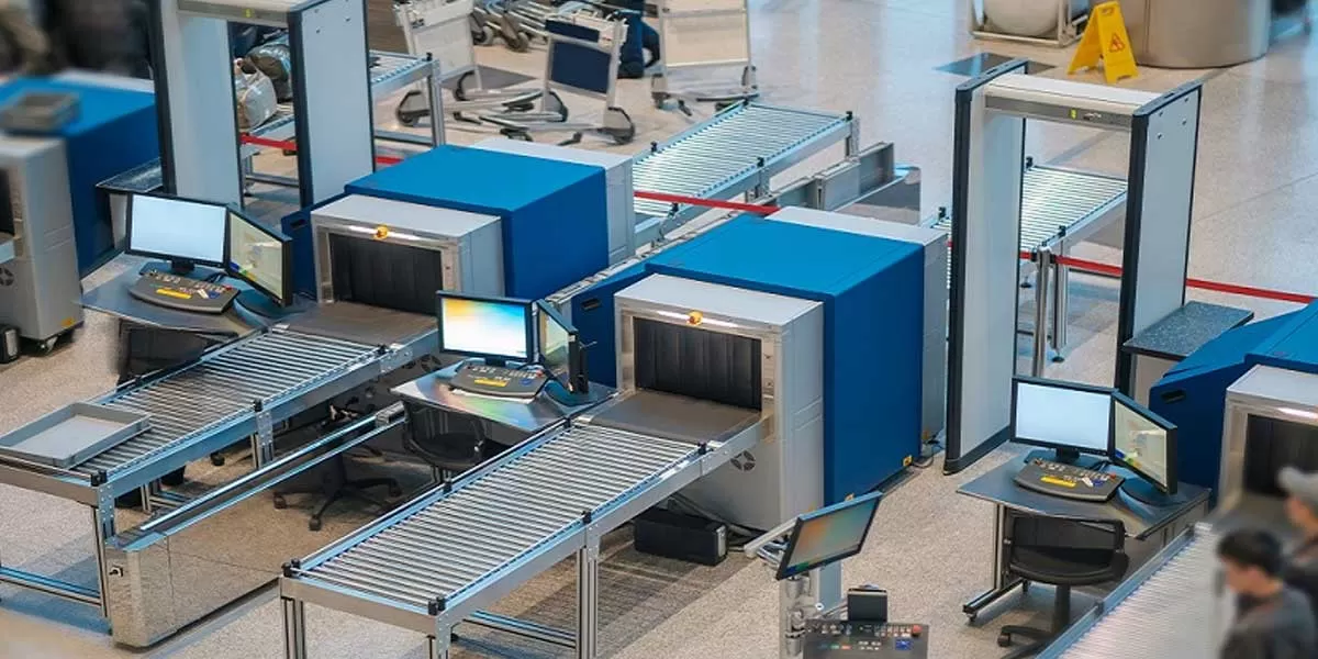 Airport security checkpoint with metal detectors and conveyor belts