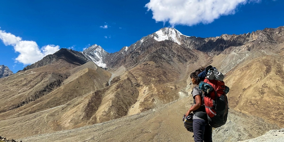 Hikers trekking through rugged Spiti Valley landscape