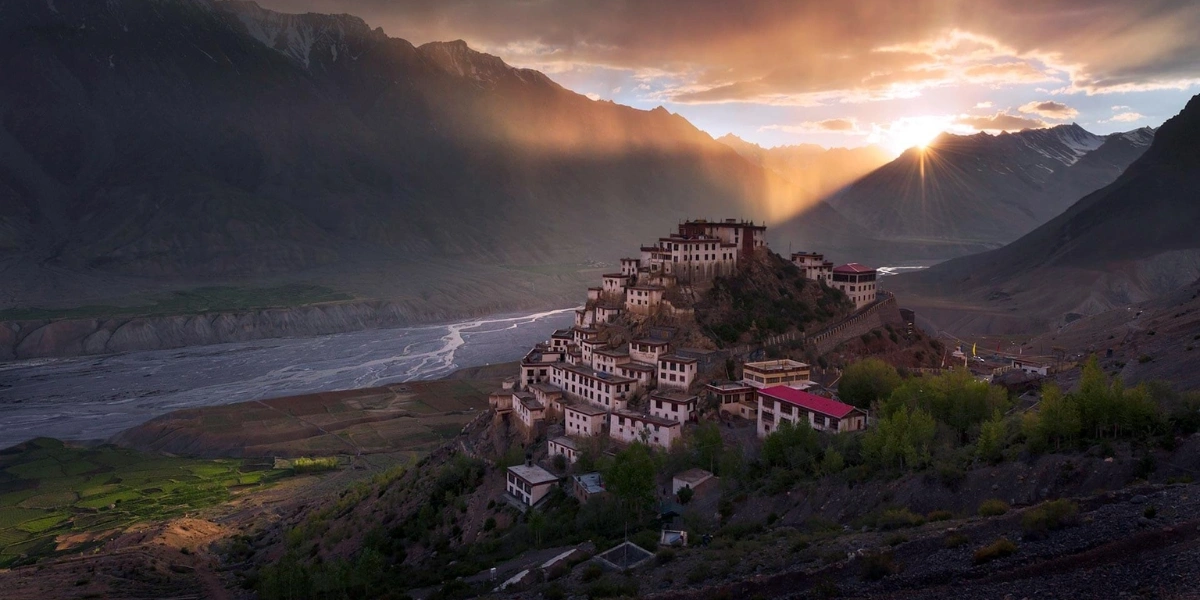Sunset over Chandratal Lake with mountains in the background