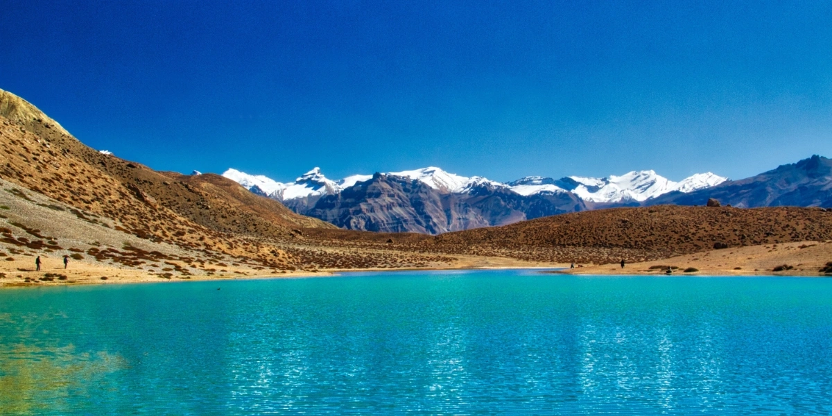 Dhankar Lake Trek in Spiti Valley Dhankar Lake above Dhankar Monastery in Spiti Valley with turquoise water and barren cliffs