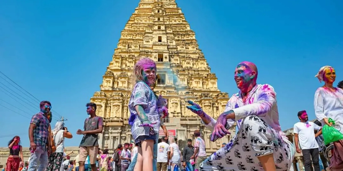 Holi Festival Among Hampi Ruins Holi 2026 celebration near ancient temple ruins in Hampi Karnataka